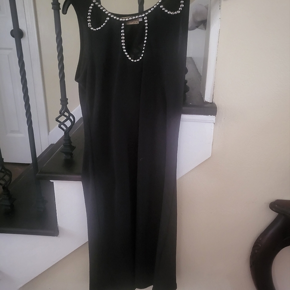 Black form fitting dress with beads on top and openings. Size small. - Picture 6 of 6